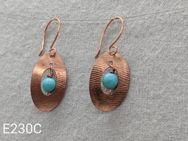 Textured copper earrings with turquoise beads