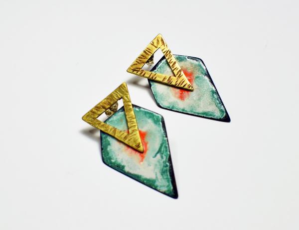 Brass Triangle posts with abstract shield picture