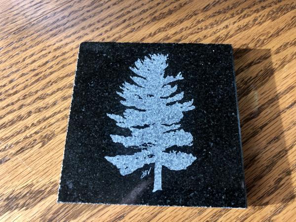 Etched white pine drink coaster or tile and polished granite picture