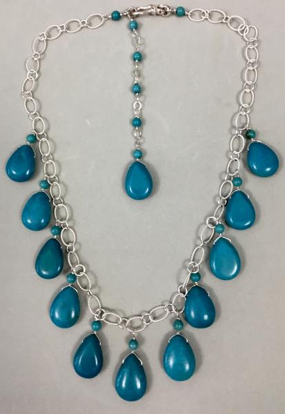 TURQUOISE PEAR SHAPED DROPS ON STERLING SILVER picture