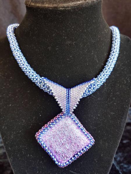 Dichroic pendant with beaded rope. picture