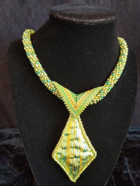 Dichroic pendant with beaded rope. picture