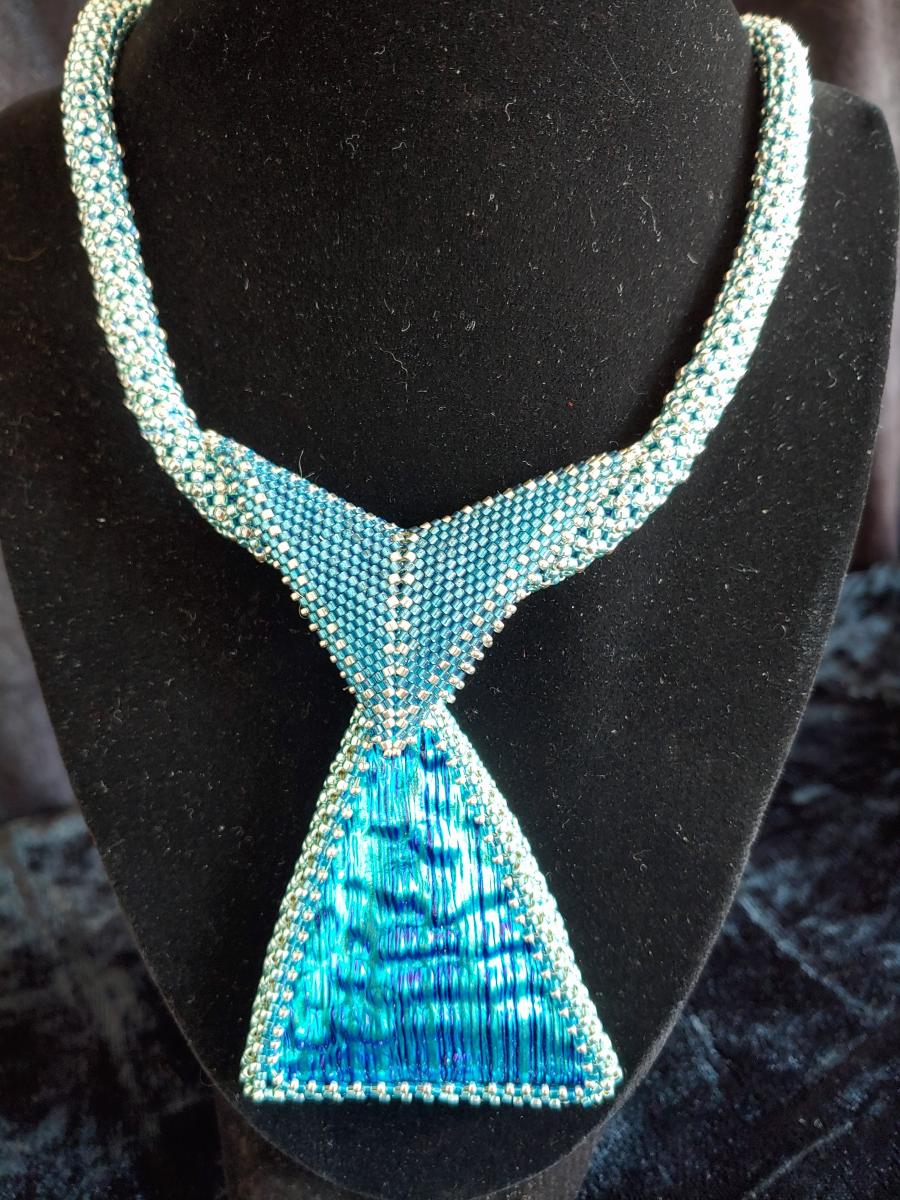 Dichroic pendant with beaded rope. picture