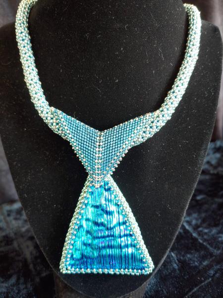 Dichroic pendant with beaded rope. picture