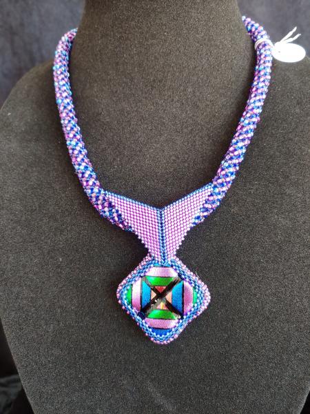 Fused dichroic glass with beading