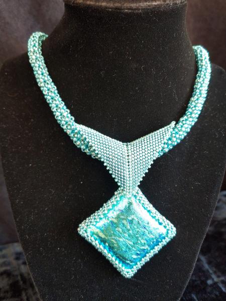 Dichroic pendant with beaded rope. picture