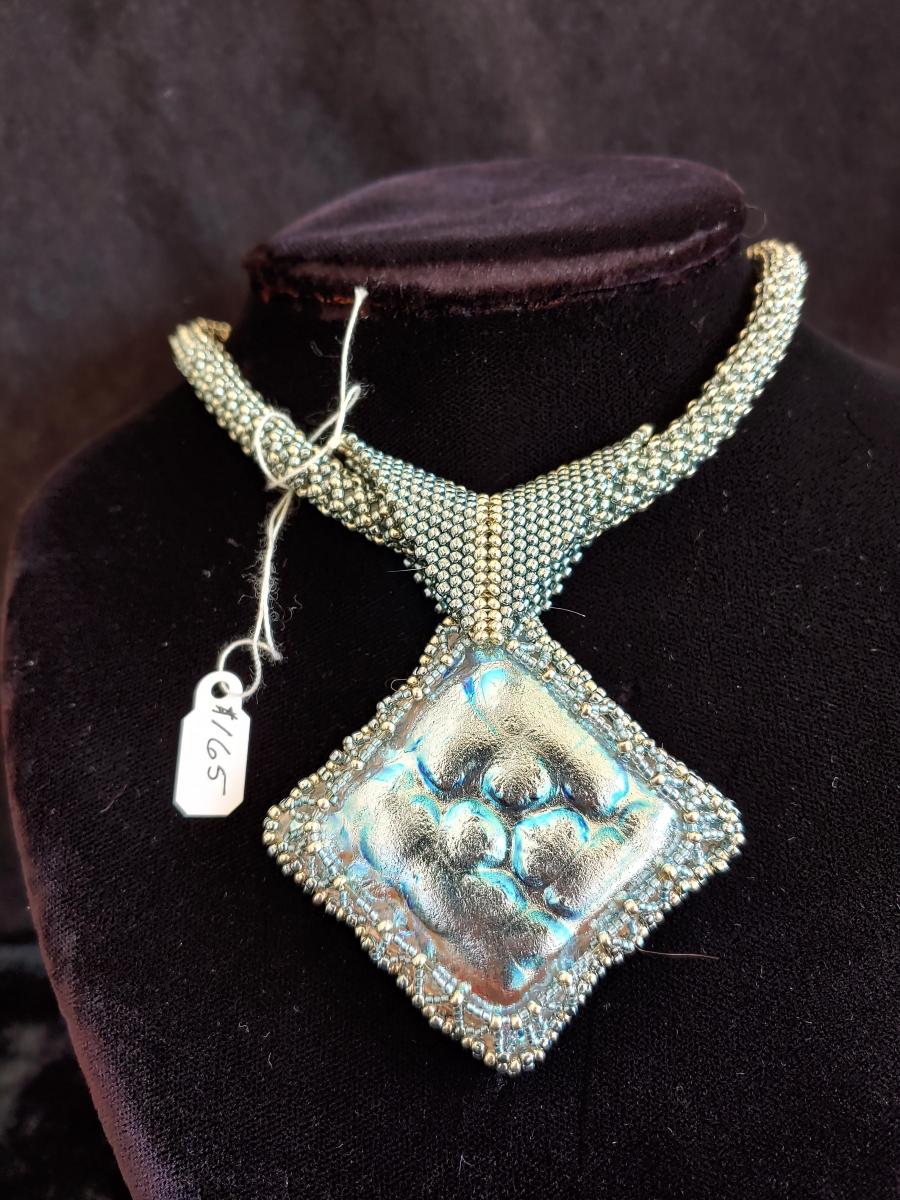 Dichroic pendant with beaded rope. picture