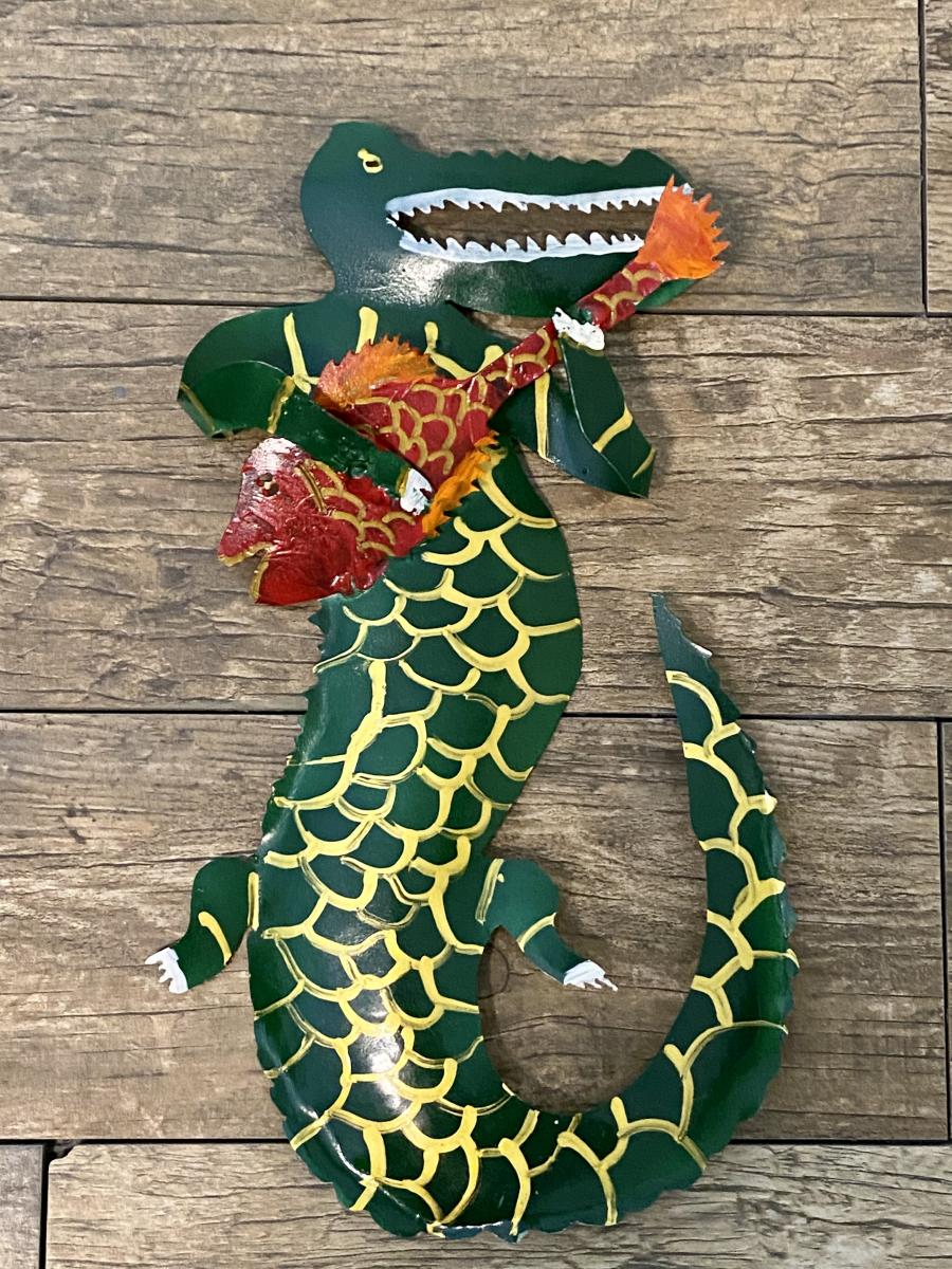 Alligator playing a fish picture