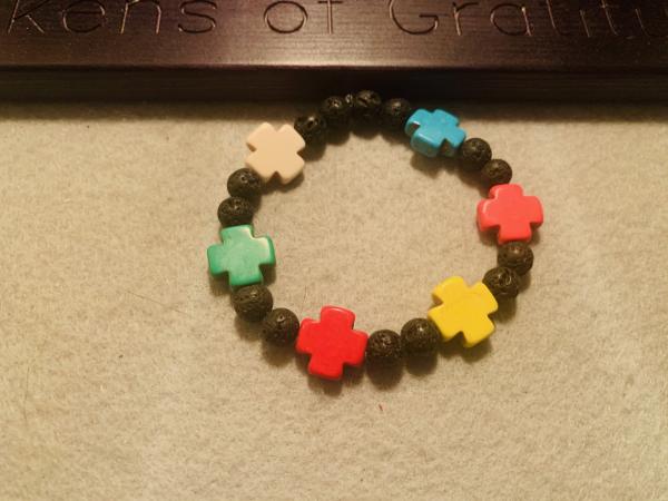Multicolored Beaded Stretch bracelet with small crosses picture