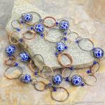 Copper-wrapped steel necklace with blue ceramic beads