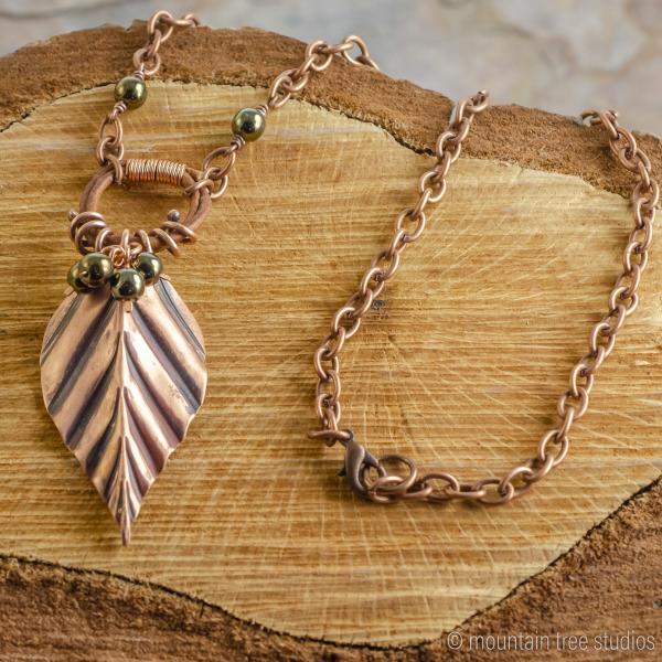 Corrugated Leaf and Vine Necklace with black-green glass picture