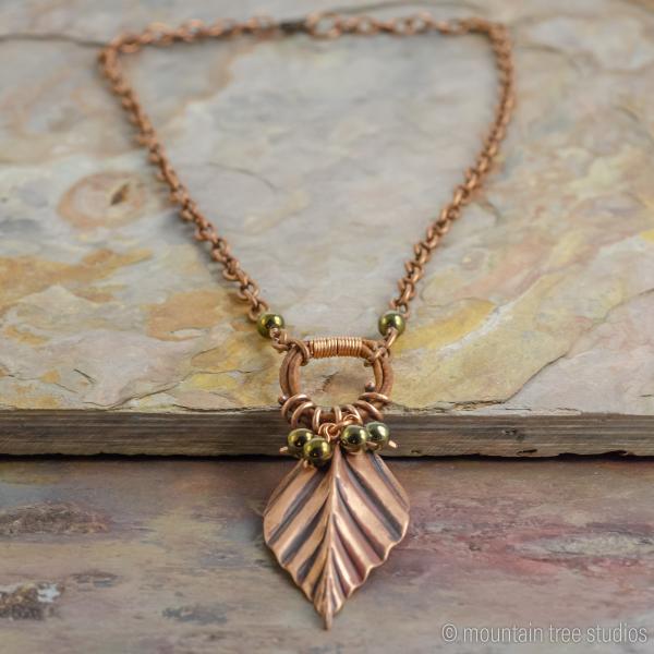 Corrugated Leaf and Vine Necklace with black-green glass picture