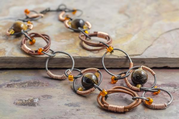 Wire-wrapped steel, leather and tigers-eye necklace picture