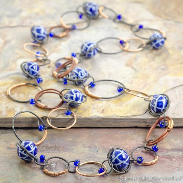 Copper-wrapped steel necklace with blue ceramic beads picture