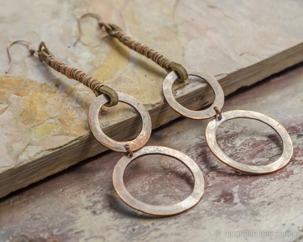 Long wrapped leather and circles earrings picture