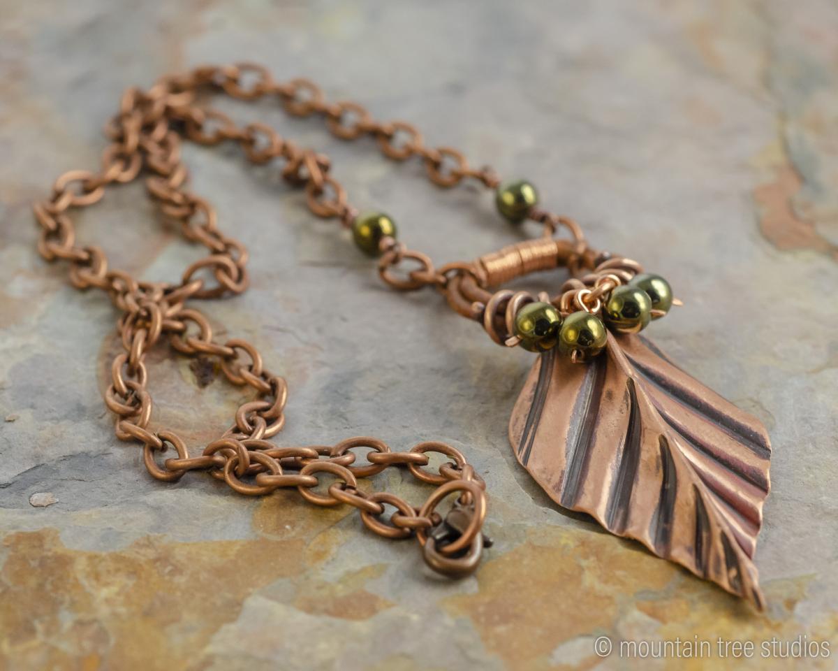Corrugated Leaf and Vine Necklace with black-green glass picture