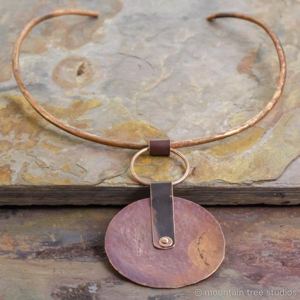 Large rustic disc pendant on torque necklace picture