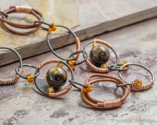 Wire-wrapped steel, leather and tigers-eye necklace picture