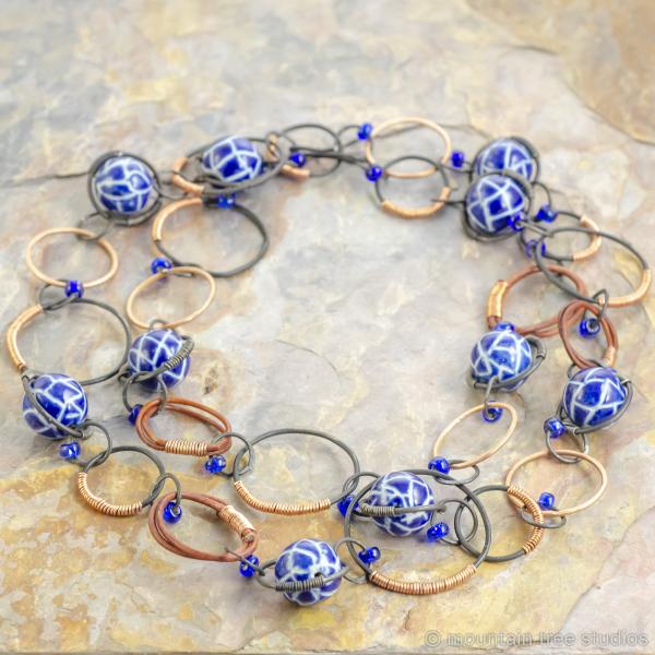 Copper-wrapped steel necklace with blue ceramic beads picture