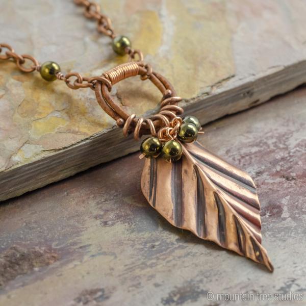 Corrugated Leaf and Vine Necklace with black-green glass picture