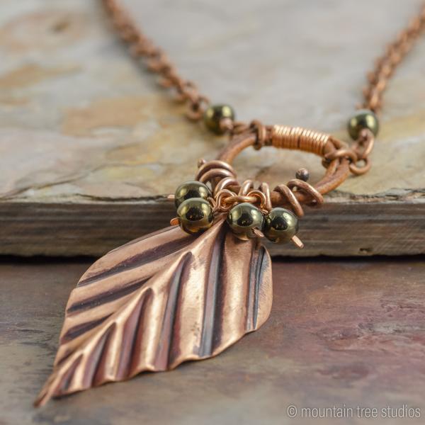 Corrugated Leaf and Vine Necklace with black-green glass picture