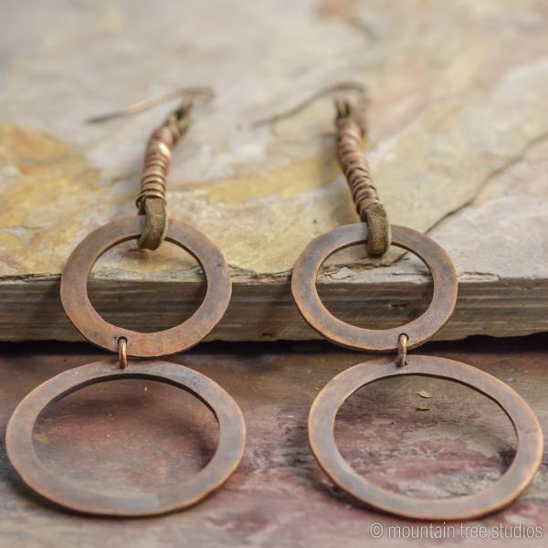 Long wrapped leather and circles earrings picture