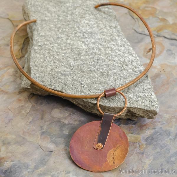 Large rustic disc pendant on torque necklace