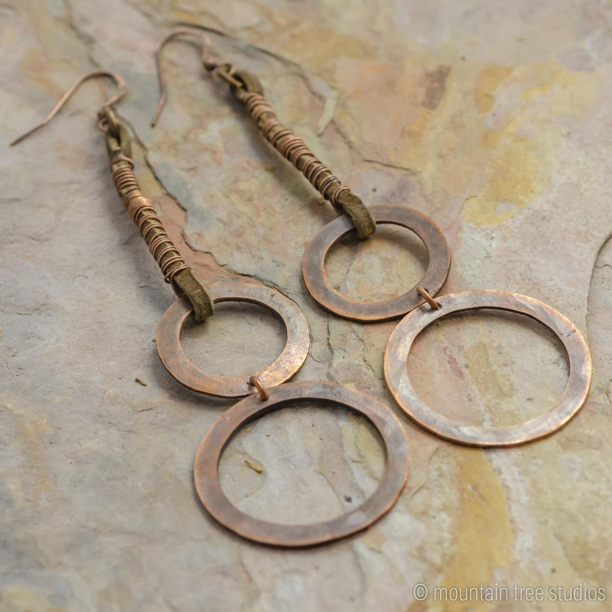 Long wrapped leather and circles earrings picture