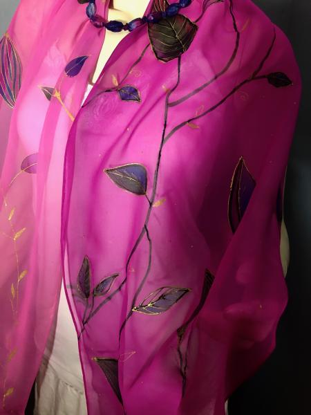 Hand Painted leaves embellished with gold resist on georgette scarf with pink background picture