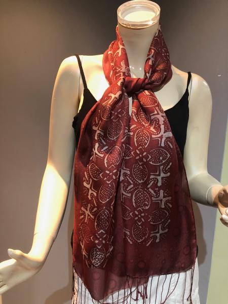 Hand Painted sheer tasseled silk scarf with Indonesian copper tjap on brownish red background picture