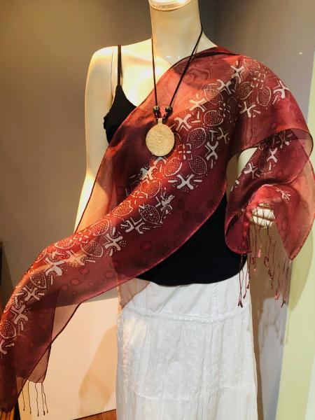 Hand Painted sheer tasseled silk scarf with Indonesian copper tjap on brownish red background picture