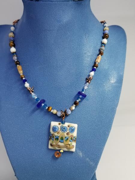 Blue Flowers in Ivory field pendant picture