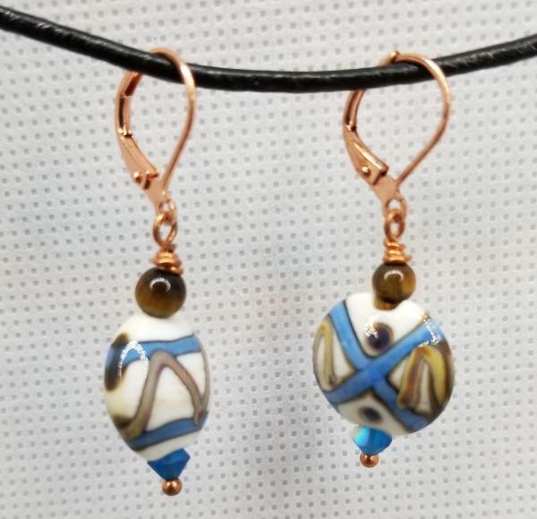 Blue and ivory colored earrings picture