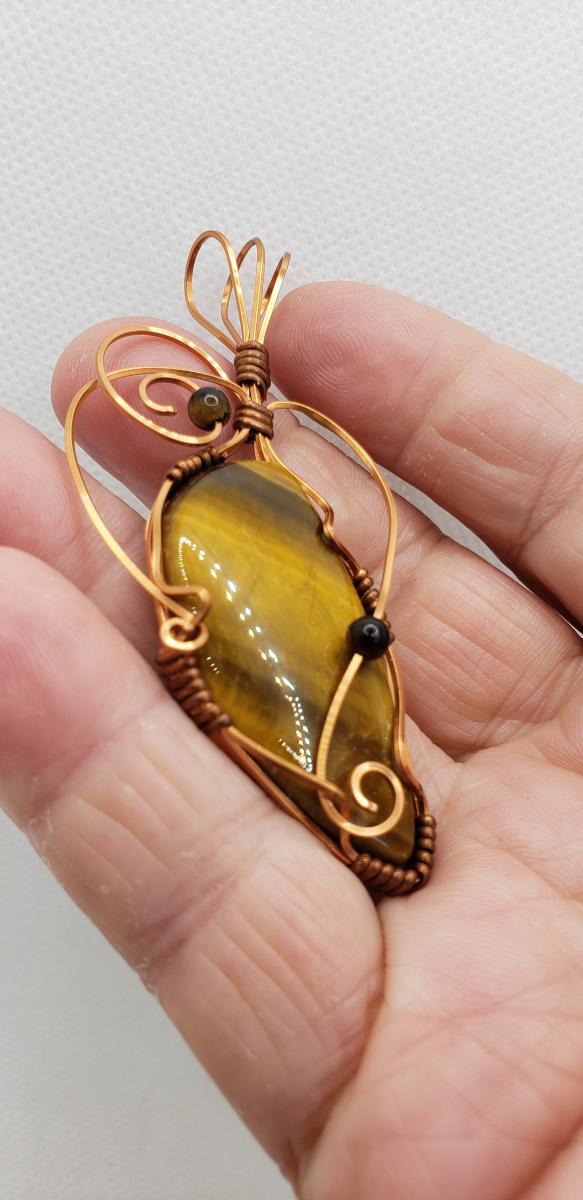 Wire wrapped Golden Tiger eye Nugget in copper wire picture