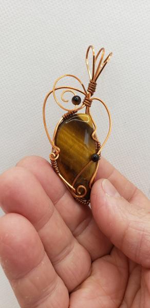 Wire wrapped Golden Tiger eye Nugget in copper wire picture