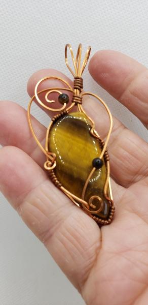 Wire wrapped Golden Tiger eye Nugget in copper wire picture