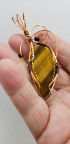 Wire wrapped Golden Tiger eye Nugget in copper wire picture