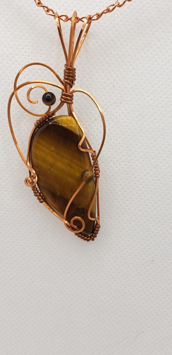 Wire wrapped Golden Tiger eye Nugget in copper wire picture