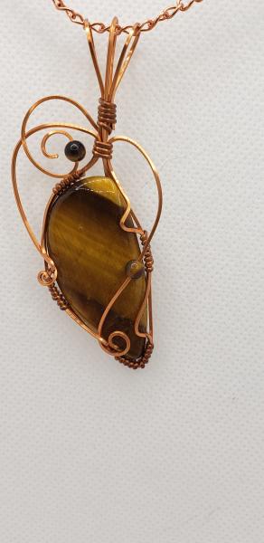 Wire wrapped Golden Tiger eye Nugget in copper wire picture