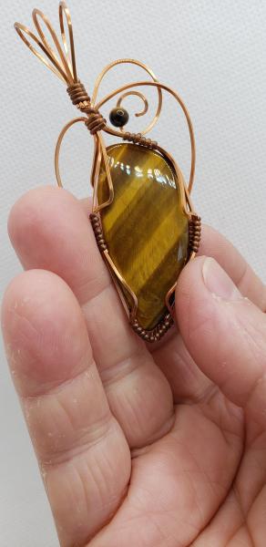 Wire wrapped Golden Tiger eye Nugget in copper wire picture