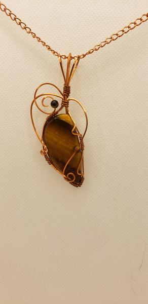 Wire wrapped Golden Tiger eye Nugget in copper wire picture