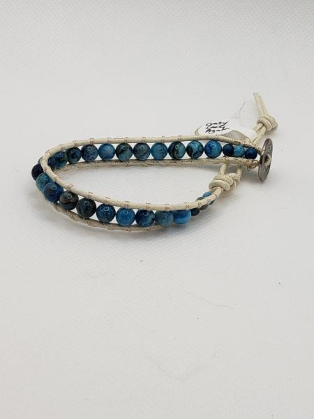 Blue Crazy Lace Agate on white leather wrapped bracelet picture