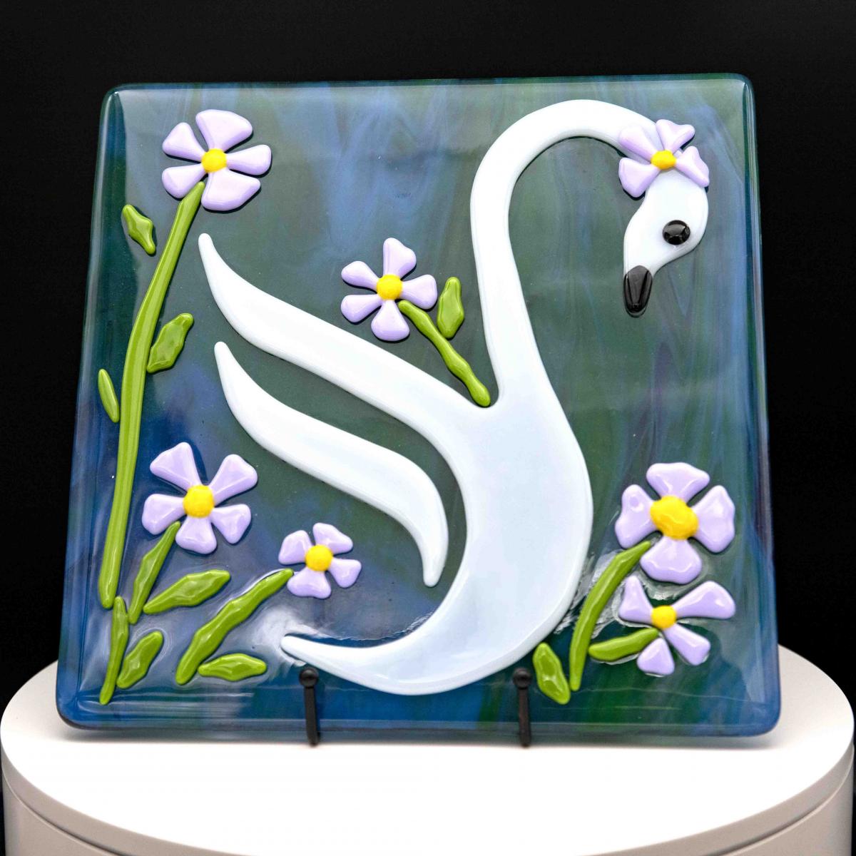 Animals - Swan in a sea of flowers picture