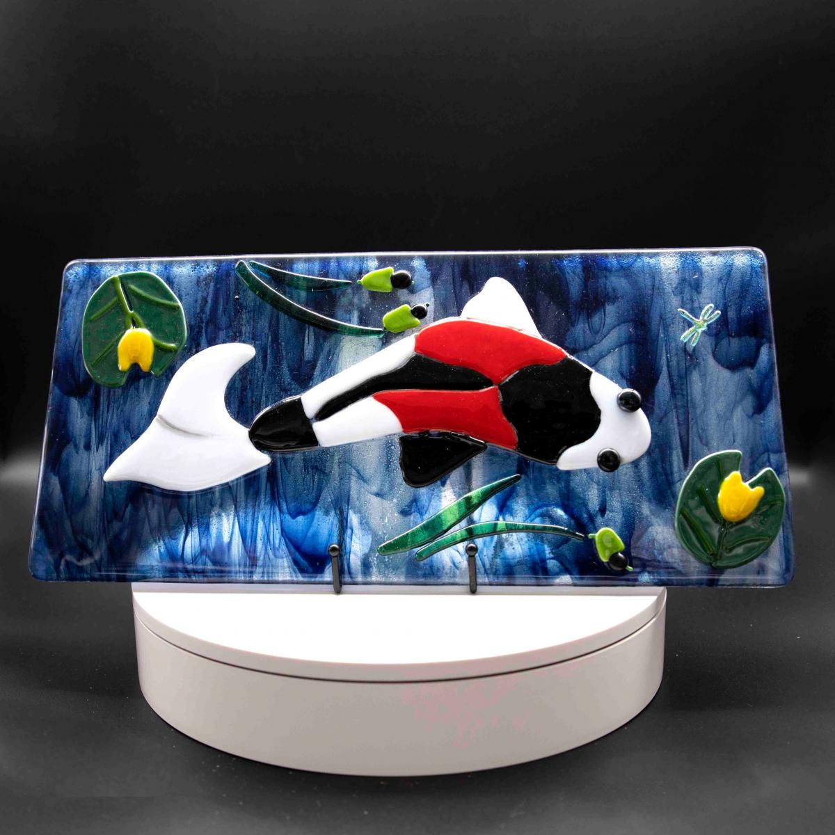 Animal - Koi fish on blue background with lily pads picture