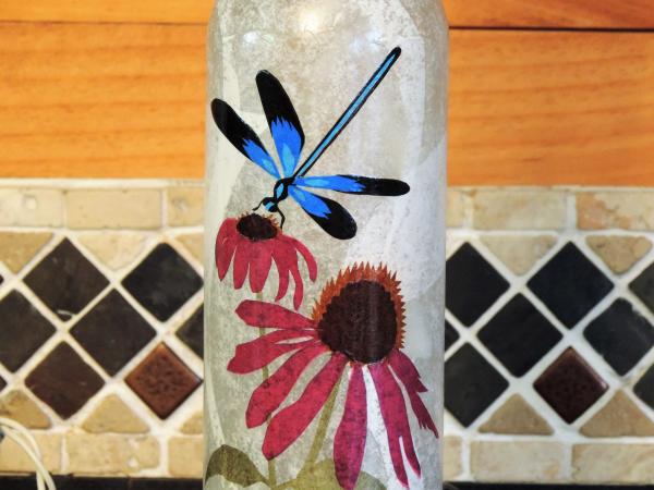 Blue dragonfly and coneflowers picture