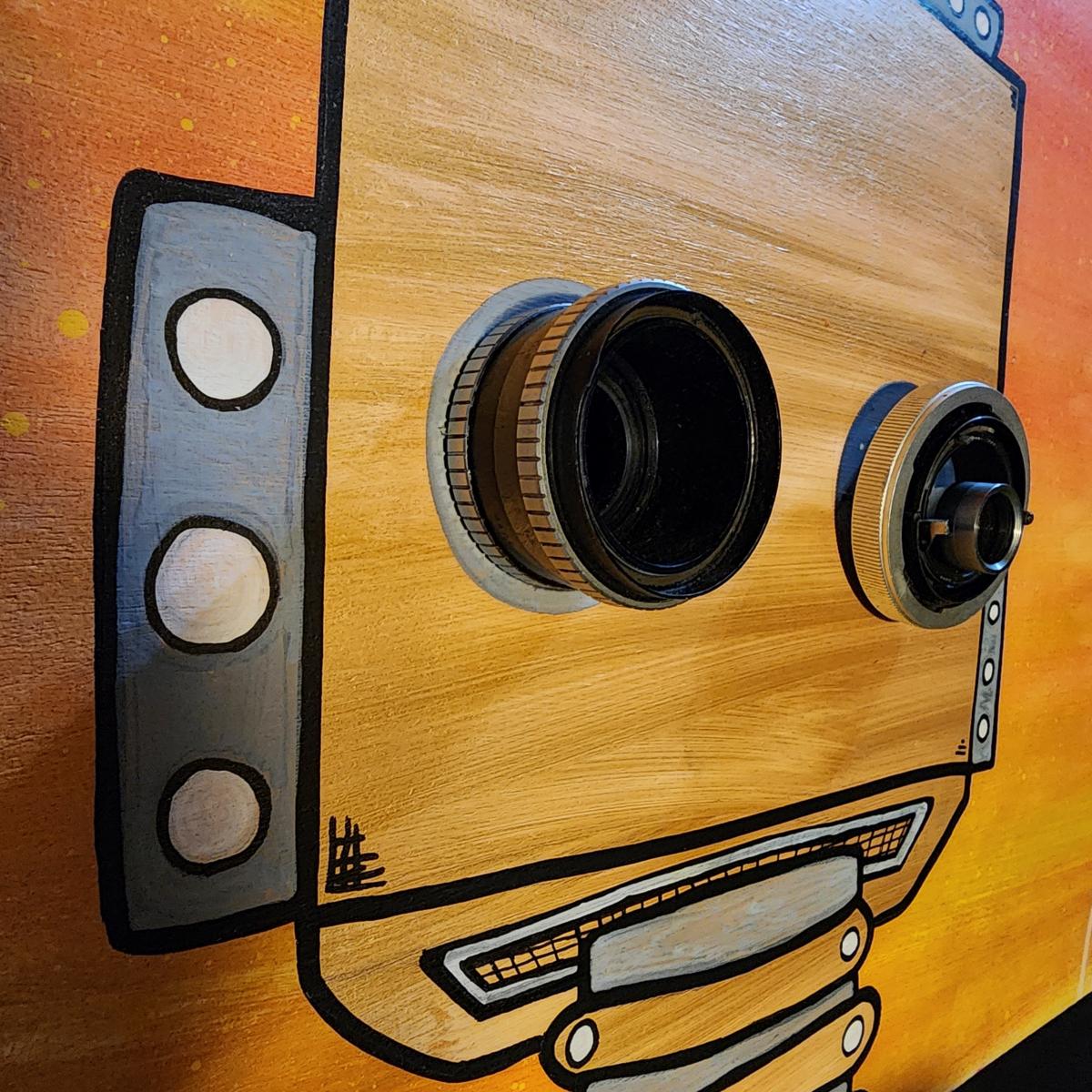 Remy: The Heartstronaut's Expedition - Dream-Inspired Robot Art with Recycled Camera Lens Eyes picture