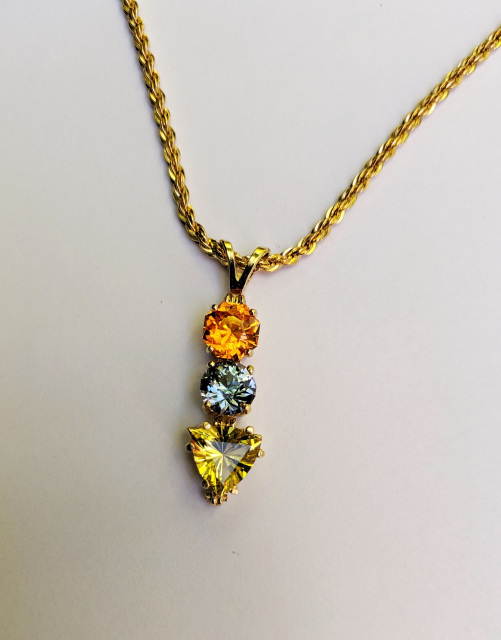 Spessartite garnet/Tanzanite, Helidor 14kt gold pendant