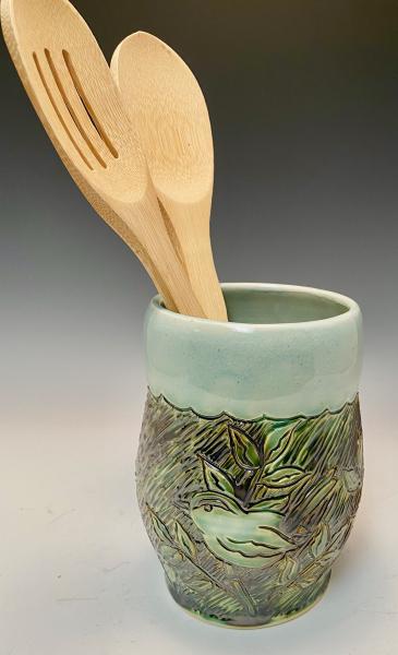 carved bird utensil holder