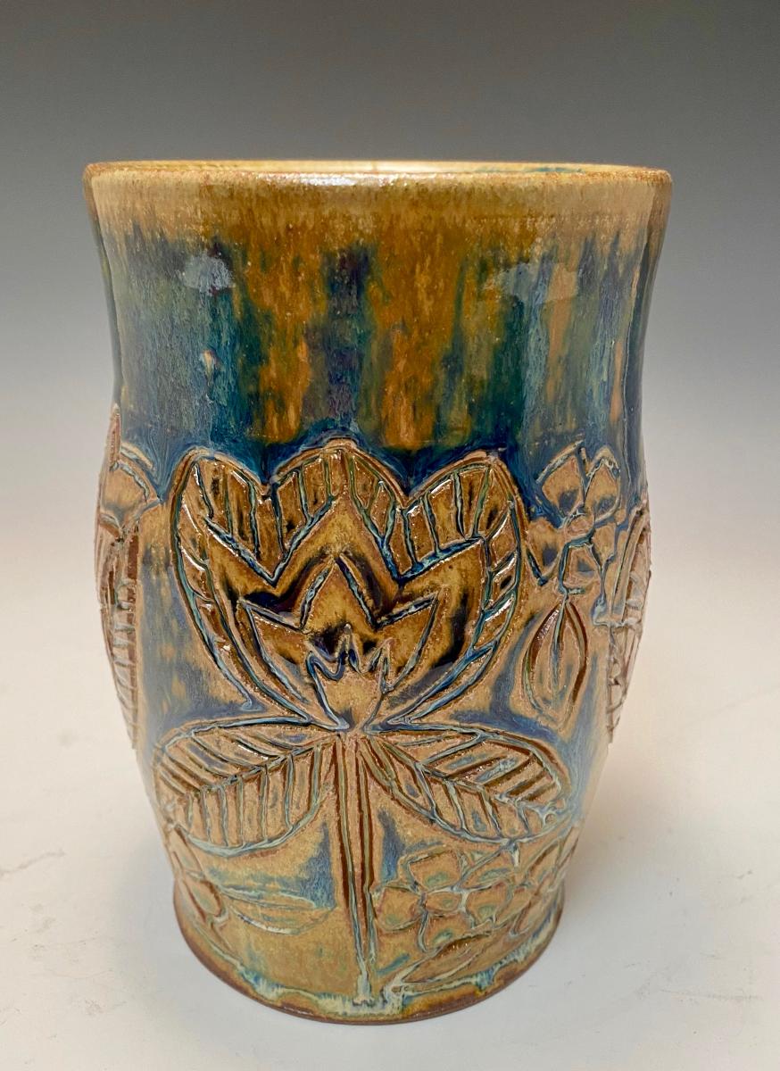 whimsical flower utensil holder/vase picture