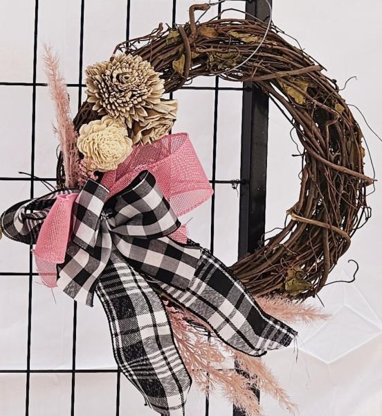 Natural wood vine wreath with wooden flowers